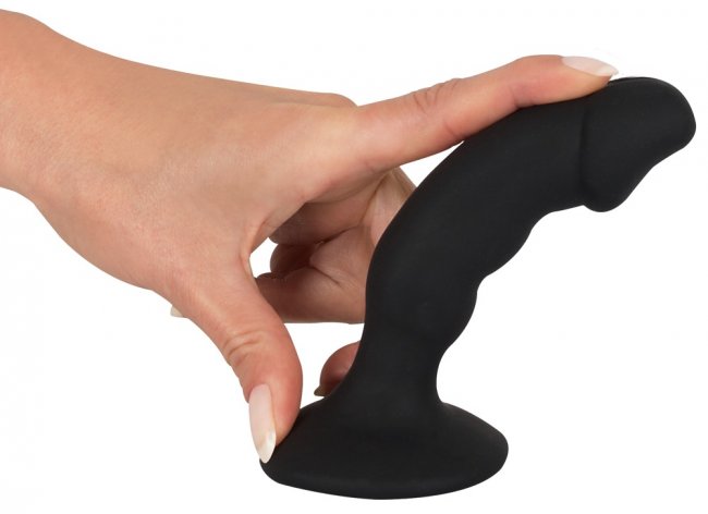 Svart analplugg med en vågig och lätt böjd form. Uppladdningsbar. 7 olika funktioner. Bred bas. P-punkts stimulering. Enkel.